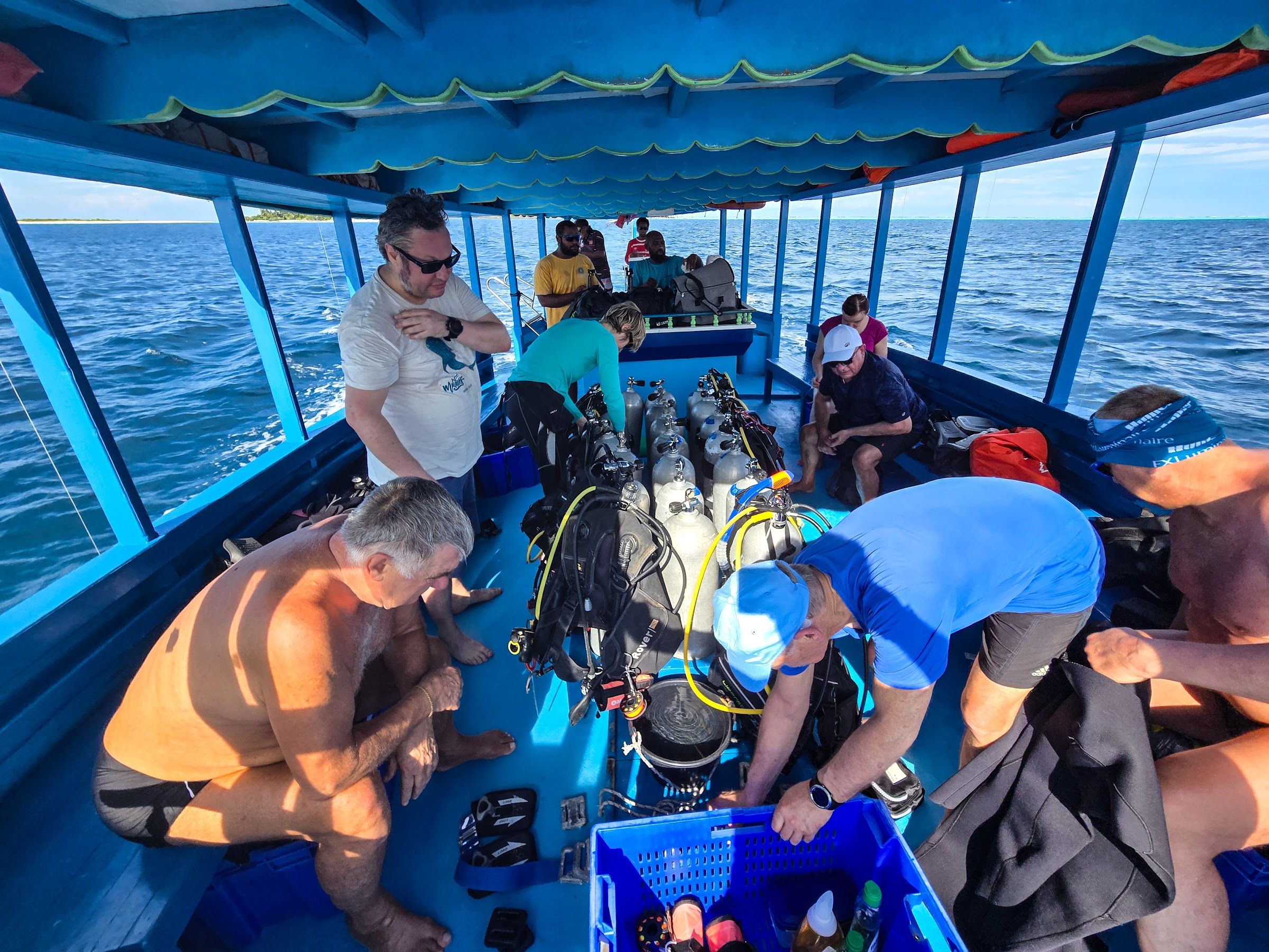 Divers kitting up on the dive boat